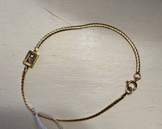 #128 - 14kt gold bracelet with plaque 2 tiny diamonds 7" approx  2gr $125