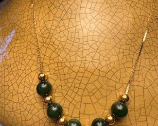 #125 - 14kt gold and jade beaded 18"L necklace 6.43 gr total -$195