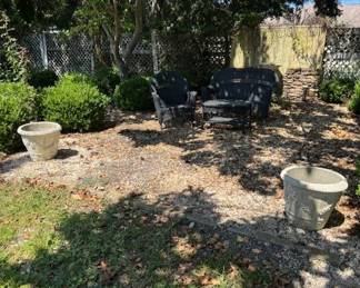 #99 - $500 - Outdoor items : Patio set - All weather wicker bench & 2 arms set, multiple terracotta planters, marble top console w/column base, 2 small park benches, O'Brien water skis.