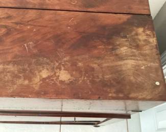 #83 - $400 - Empire mahogany Captain /Campaign desk - missing 3 knobs on drawer, 31x17x34H - damages on veneer.