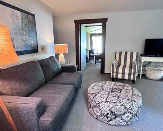 LIVING ROOM FURNITURE INCLUDING SOFA, OTTOMAN, STRIPED CHAIR, TV, LAMPS