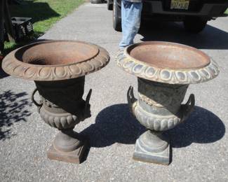 Pair cast iron urns with lion face handles $895. (pair)