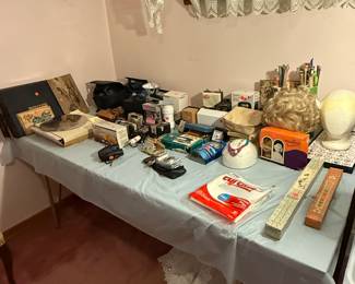 Vintage cameras, Thorens music discs, travel clocks, wig