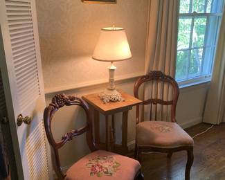 two antique needle point chairs, Asian embroidered wall art, antique table, wrought iron lamp