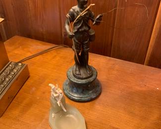 two small sculptures, fisherman and pied piper