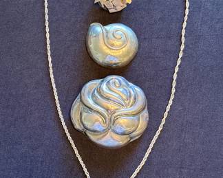 Silver brooches and pendants