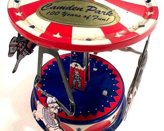 Souvenir Schilling tin merry-go-round