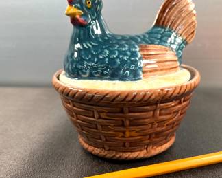 Small hen in basket dish