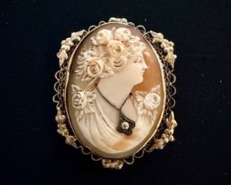 Cameo with gold filigree border