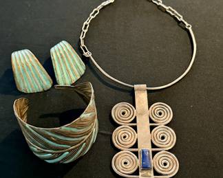 Handcrafted cuffs, earrings, and chokers
