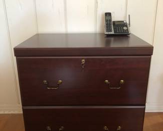 My. Airy Lateral file cabinet with legal size file folders. Locking drawers.