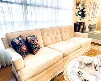 Large Drexel Shelter back Sofa upholstered in Creme Ultra Suede and wonderful Pecan legs with Brass caps