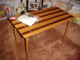 sewing table with ruler on table top