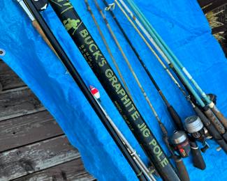 lots of fishing rods - most with reels