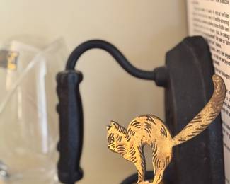 fun little scaredy cat bell and antique sad iron 