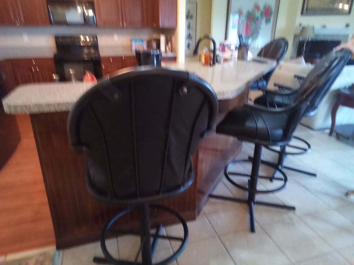 4 black metal and vinyl bar stools