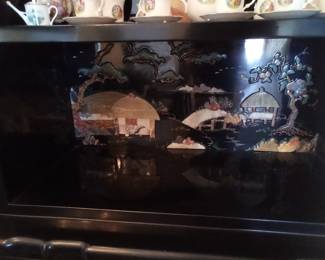 Inlaid picture inside the china cabinet