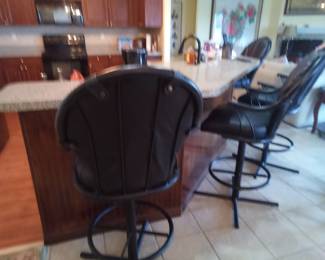 4 black metal and vinyl bar stools