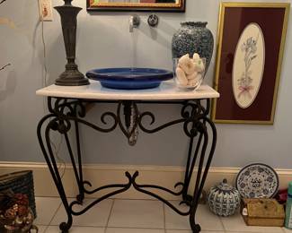 Iron & marble top stand. Assorted artwork.