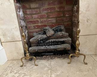 Brass andirons.