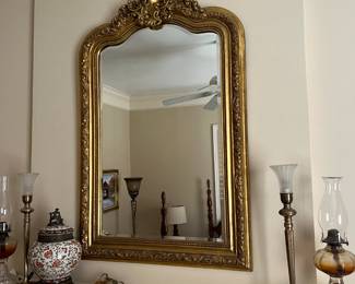 Gold framed mirror lamps.