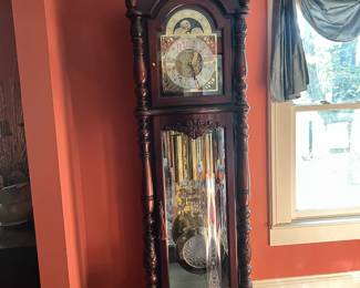 Great Howard Miller grandfather clock w/brass & crystal pendulum.