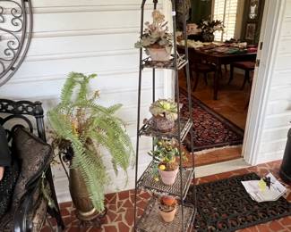 tall metal shelf unit w/misc items.