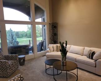 Cream section sofa/ LAZ Boy swivel chairs/ Nesting tables