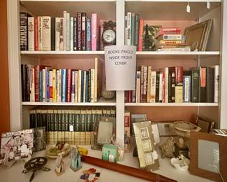 Loads of books and trinkets. Quantities of table frames