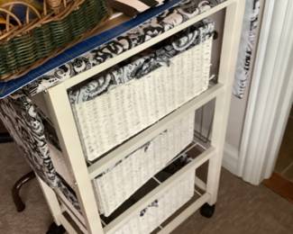 Three drawer wicker storage cart.