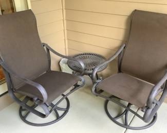 Two brown mesh chairs that rock and swivel