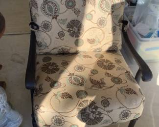 Outdoor metal chair and ottoman with cushions