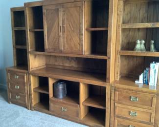 This wall unit is six pieces. The end units measure: top is 46” h x 24 w x 10 d and bottom is 24 w x 18” d x 30” h. The middle unit is 60” wide. Bottom is 30” h and 18” d. The top is 46” h x 18” d. Each end is $80 and middle is $150. Whole unit would be $275.