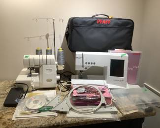 Pfaff sewing machine and threader…..both with accessories. Lots of fabric and craft supplies.
