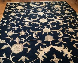 8 x 10 black and tan print rug. Presale $300