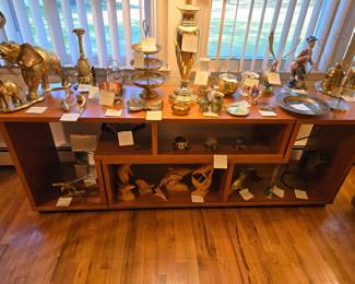 L shaped 2 piece (heavy )real wood display unit. Lots of brass and antique collectibles..also hand carved wood pieces
