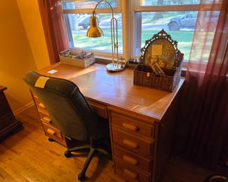 Real wood desk on wheels with filing cabinets and drawers. Chair sold separately .