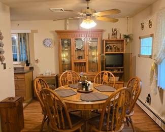 Oak dining set with 24 in leaf and 6 chairs with pads. Also glass table protective top