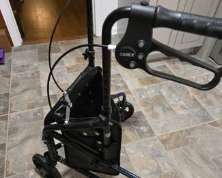 Carex 3 wheel adjustable, foldable, light weight walker with hand brakes and storage pouch in front..like new