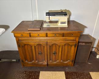 Singer Athena 2000 model sewing machine on sewing cabinet