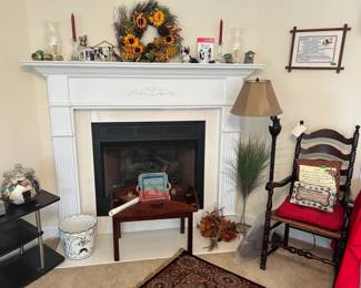 wreath, one of many floor lamps, shaker chair, butler table, needlepoint, brass, hurricane shades, Boston Terrier stuff