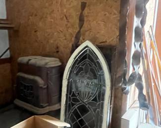 stained glass windows, very large wind chimes that need a little love , cast iron wood stove