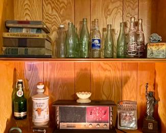 OLD BOOKS, VINTAGE COLA BOTTLES, RCA CLOCK RADIO, TEXAS LONGHORN DECANTER, OLD PENN FISHING REEL