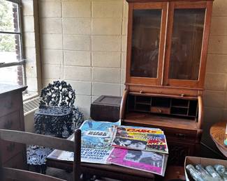 Cylinder desk (two pieces); various iron furniture pieces; movie posters....