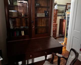 Secretary. No storage under the desk top that lifts. Drawer is functional