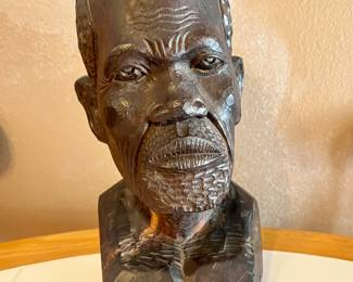 This is a Shona sculpture of an elder, hand-carved by the Shona people of Zimbabwe