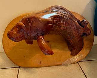 Hand carved wooden manatee hanging art