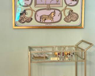 Hermes Scarf (framed) and bar cart filled with decanturs, glassware, copper ice buckets