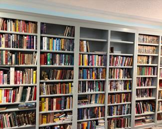 Decades of collecting books in one wall! Some first editions