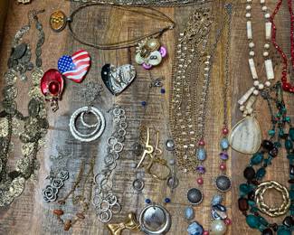 Costume jewelry necklaces, bracelets, earrings, and brooches/pins